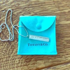 Tiffany bar necklace in Tiffany pouch.